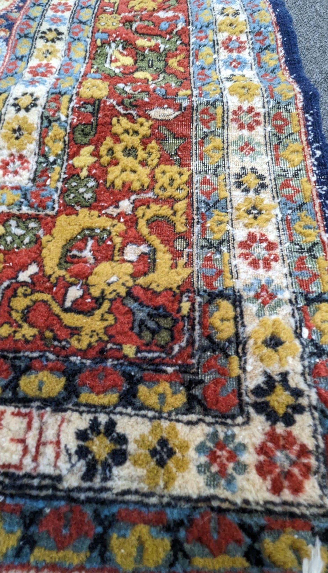 A Hereke blue ground carpet with central field of boteh motifs, 276 x 186cm